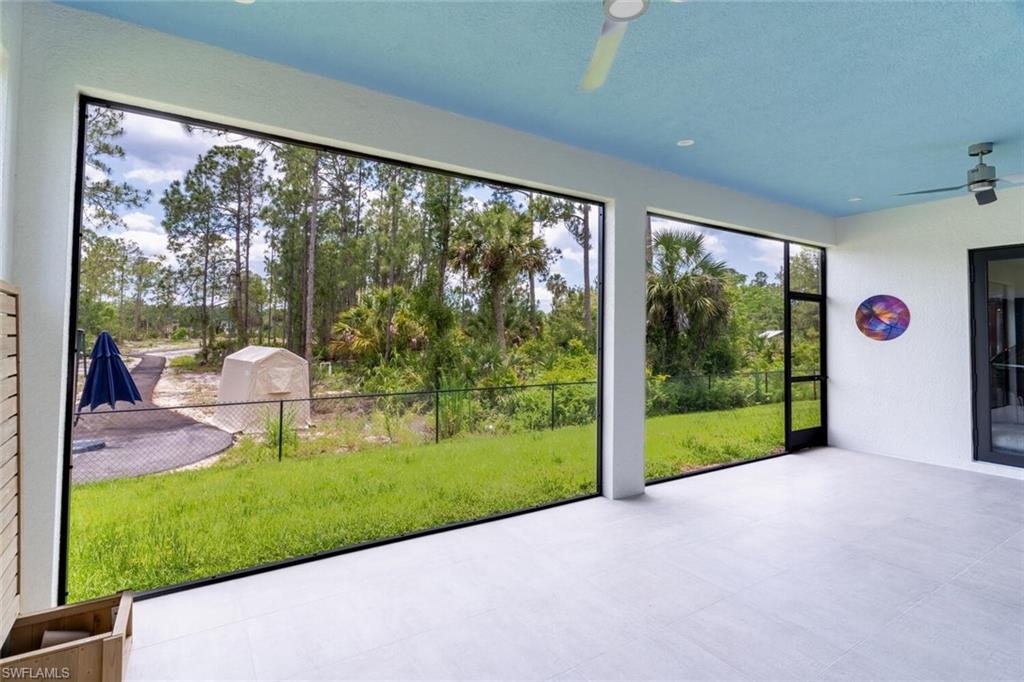 2572 Randall Boulevard Naples, FL 34120 - Photo 35 of 45 a view of a porch and garden