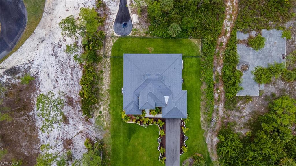 2572 Randall Boulevard Naples, FL 34120 - Photo 40 of 45 an aerial view of a house with a yard