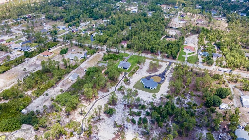 2572 Randall Boulevard Naples, FL 34120 - Photo 41 of 45 an aerial view of residential house with outdoor space and swimming pool