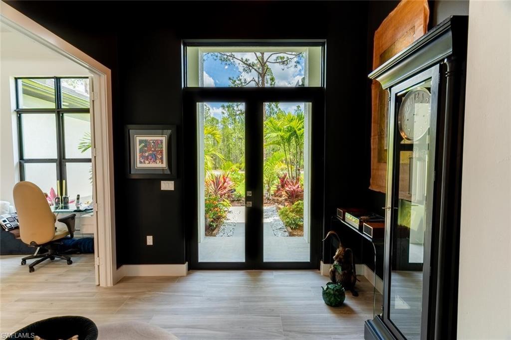 2572 Randall Boulevard Naples, FL 34120 - Photo 7 of 45 a view of room with workspace and windows
