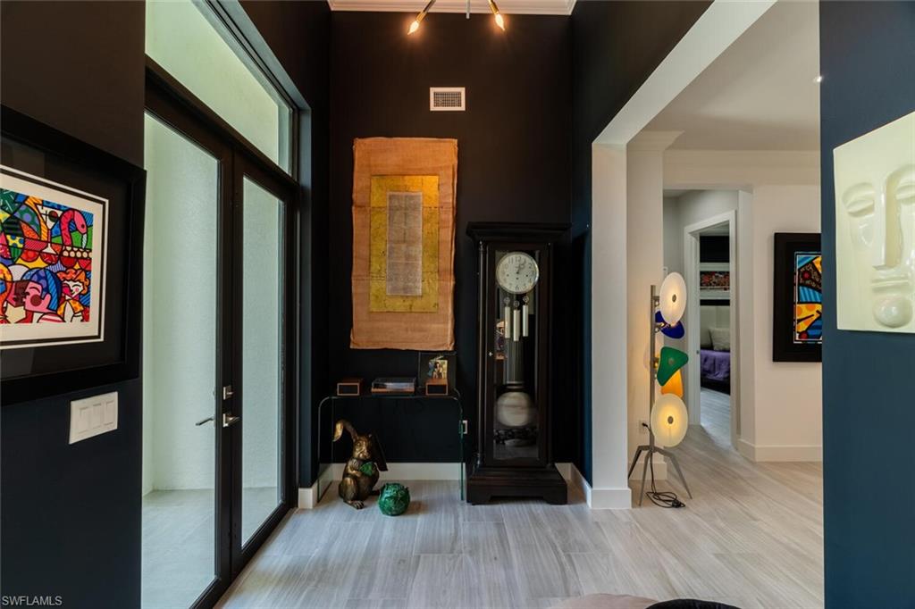 2572 Randall Boulevard Naples, FL 34120 - Photo 8 of 45 a view of a entryway door of the house