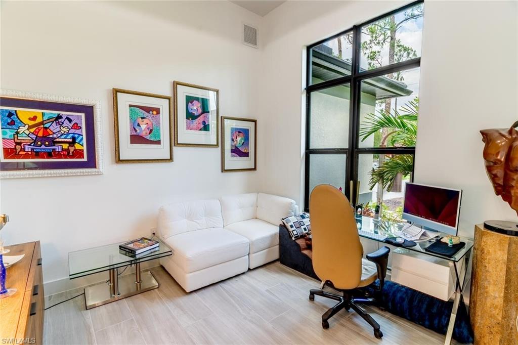 2572 Randall Boulevard Naples, FL 34120 - Photo 9 of 45 a living room with furniture and a window