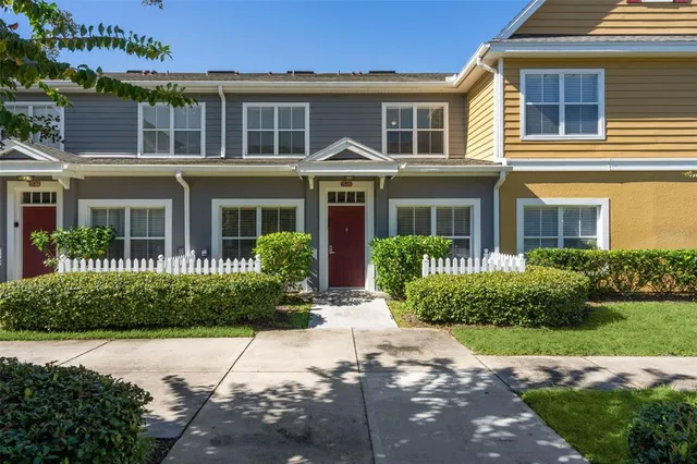 front view of a brick house with a yard