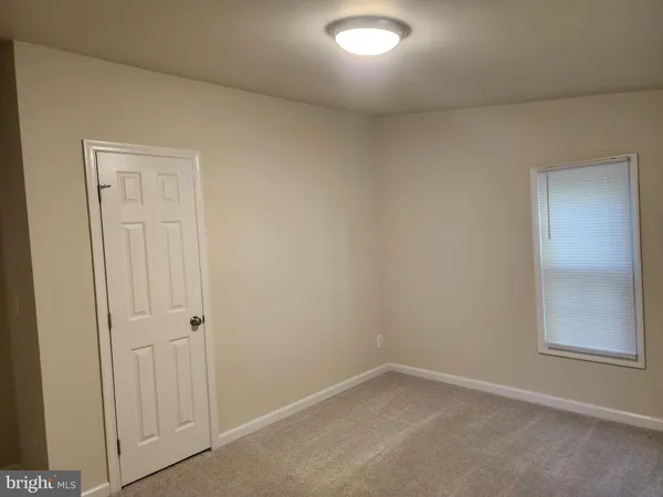 a view of a hallway with closet