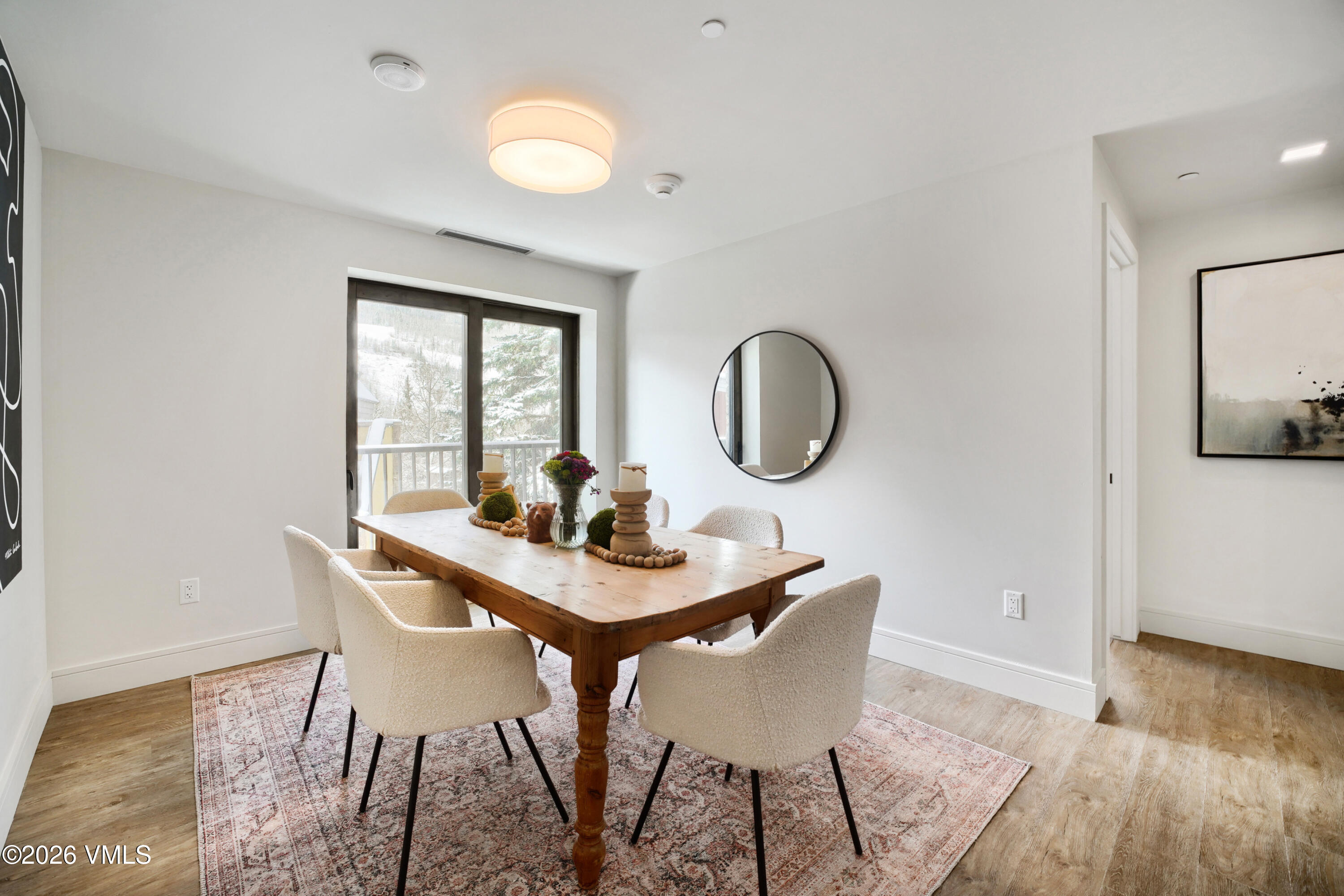 430 South Frontage Road East, Unit RUE Vail, CO 81657 - Photo 14 of 24 a view of a dining room with furniture and wooden floor