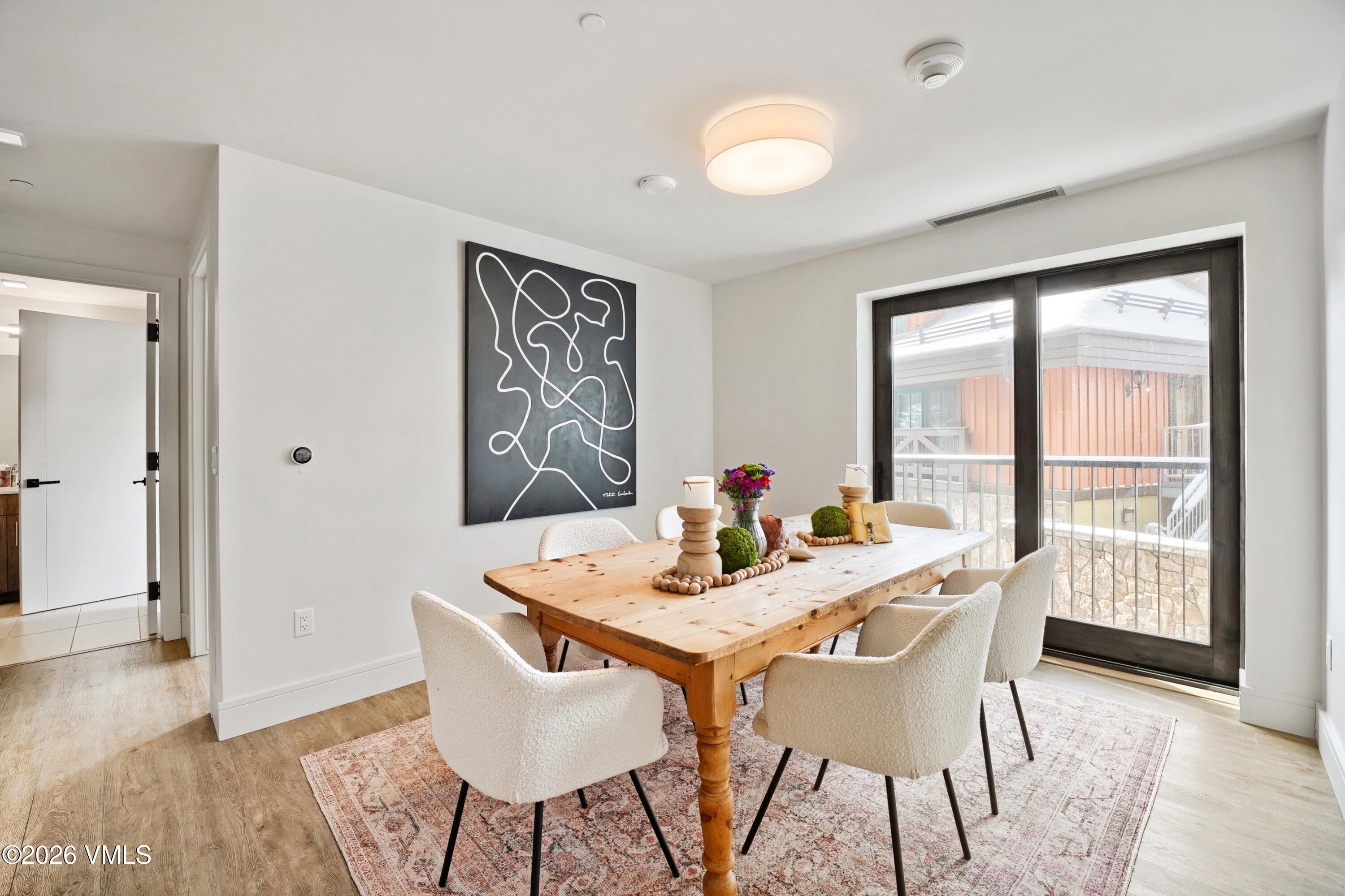 430 South Frontage Road East, Unit RUE Vail, CO 81657 - Photo 15 of 24 a view of a dining room with furniture window and wooden floor