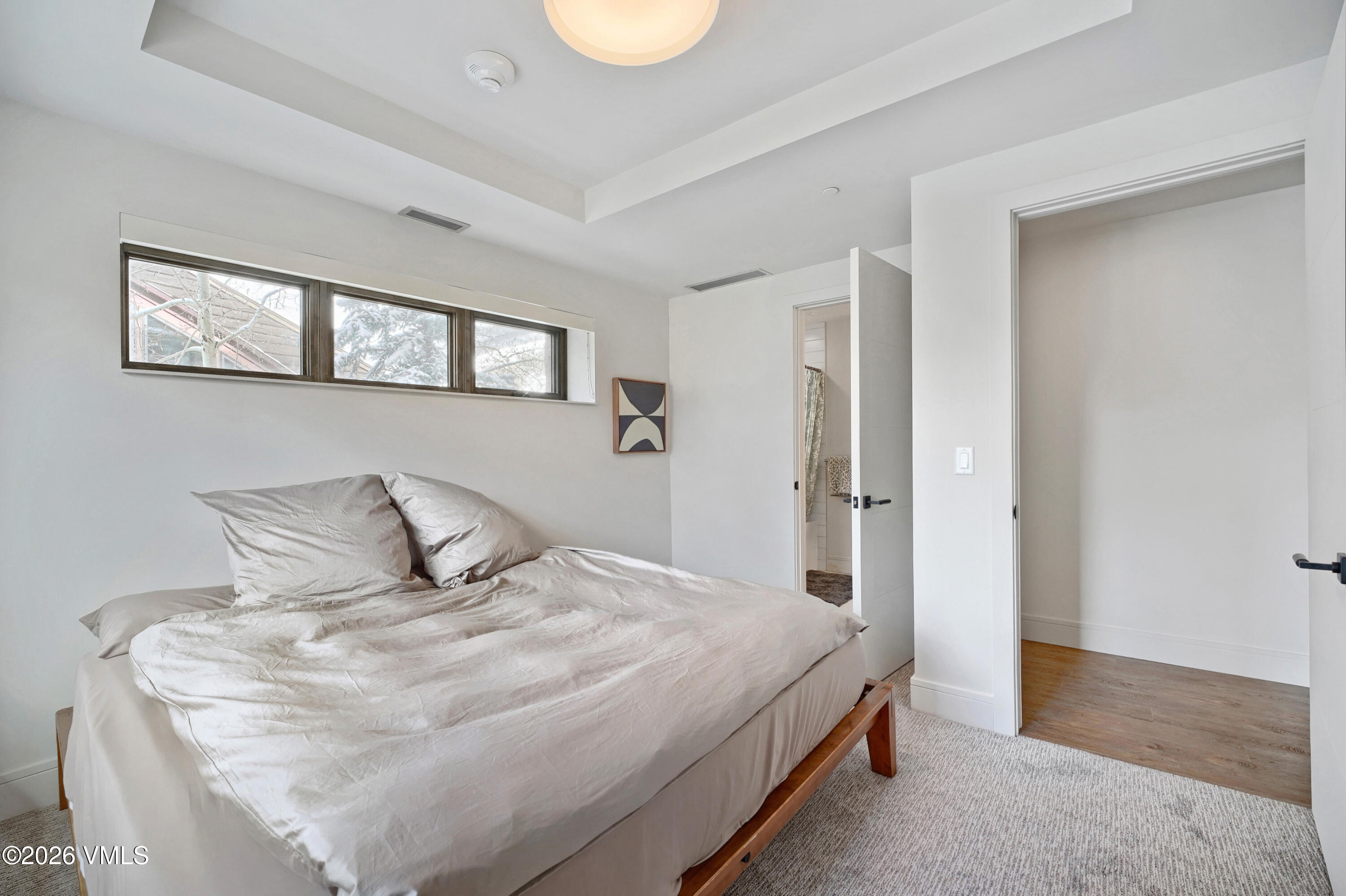 430 South Frontage Road East, Unit RUE Vail, CO 81657 - Photo 18 of 24 a bedroom with a bed and a window