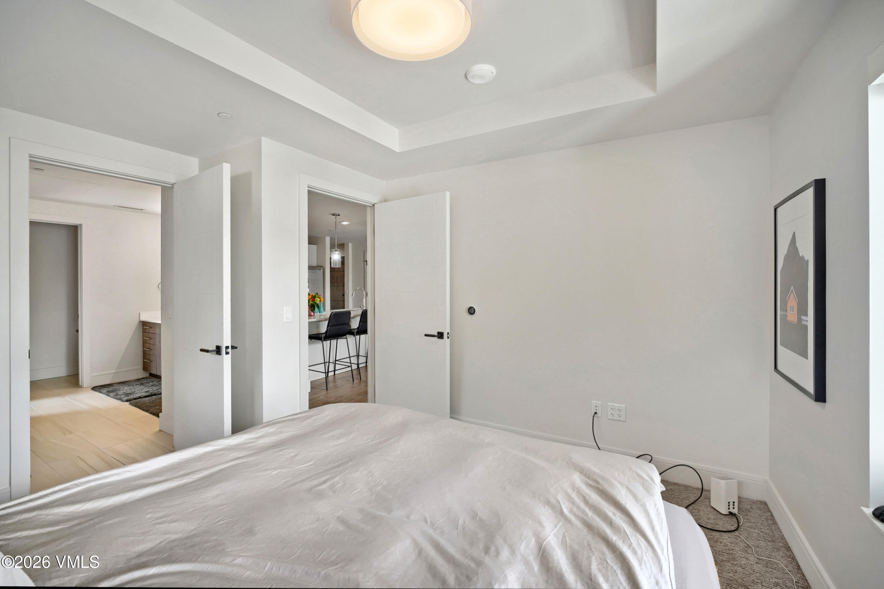 430 South Frontage Road East, Unit RUE Vail, CO 81657 - Photo 19 of 24 a bedroom with a bed and a mirror