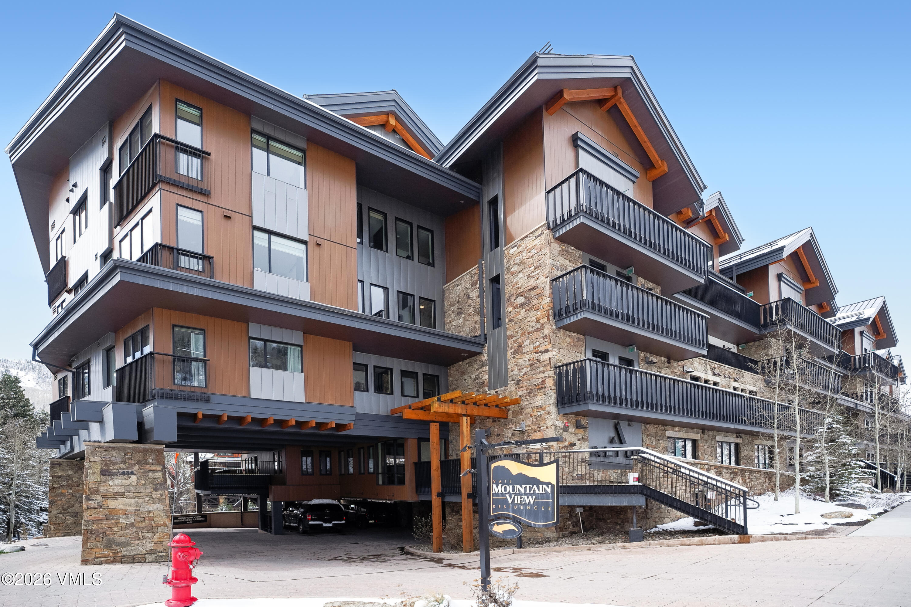 430 South Frontage Road East, Unit RUE Vail, CO 81657 - Photo 2 of 24 a view of a building with car parked