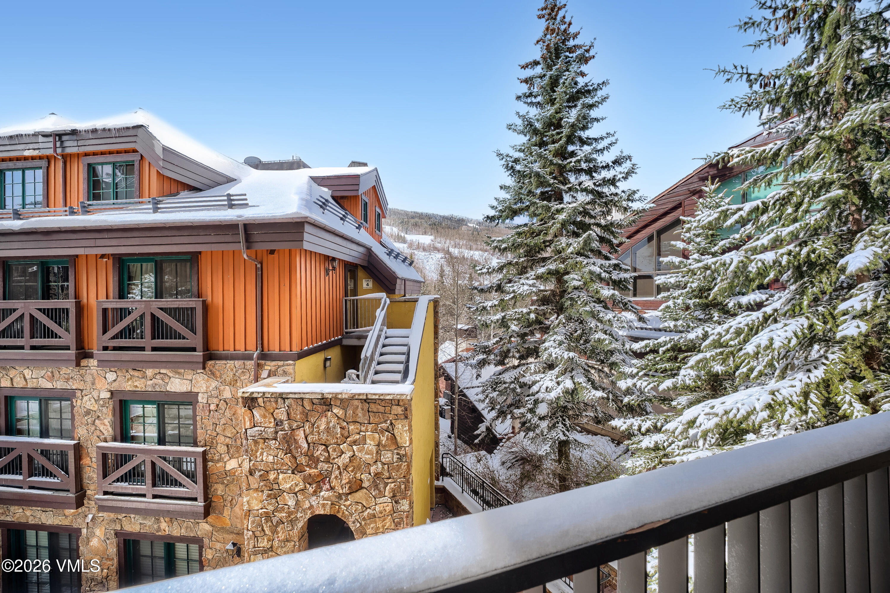 430 South Frontage Road East, Unit RUE Vail, CO 81657 - Photo 23 of 24 a view of a brick house with large windows