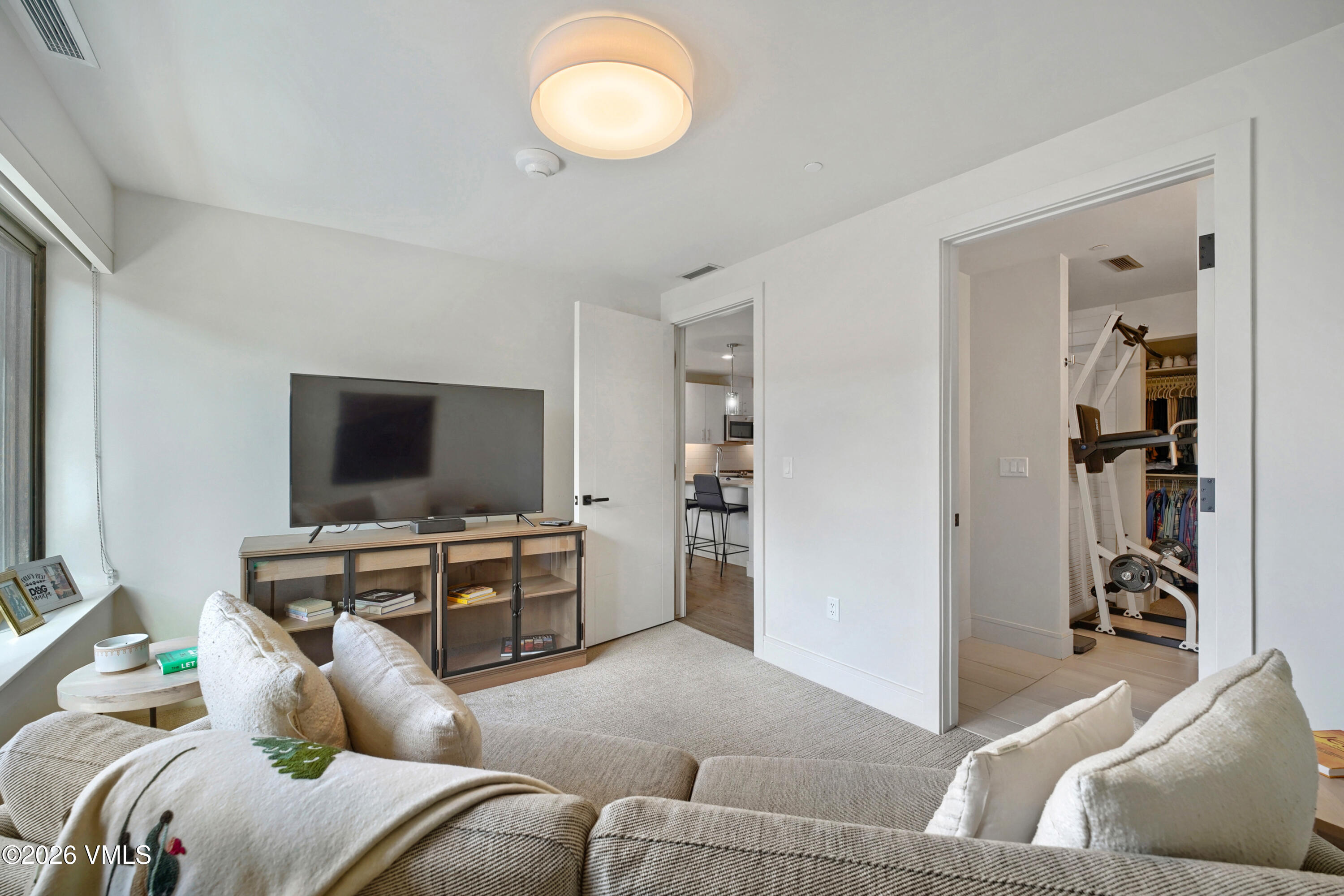 430 South Frontage Road East, Unit RUE Vail, CO 81657 - Photo 5 of 24 a living room with furniture and a flat screen tv