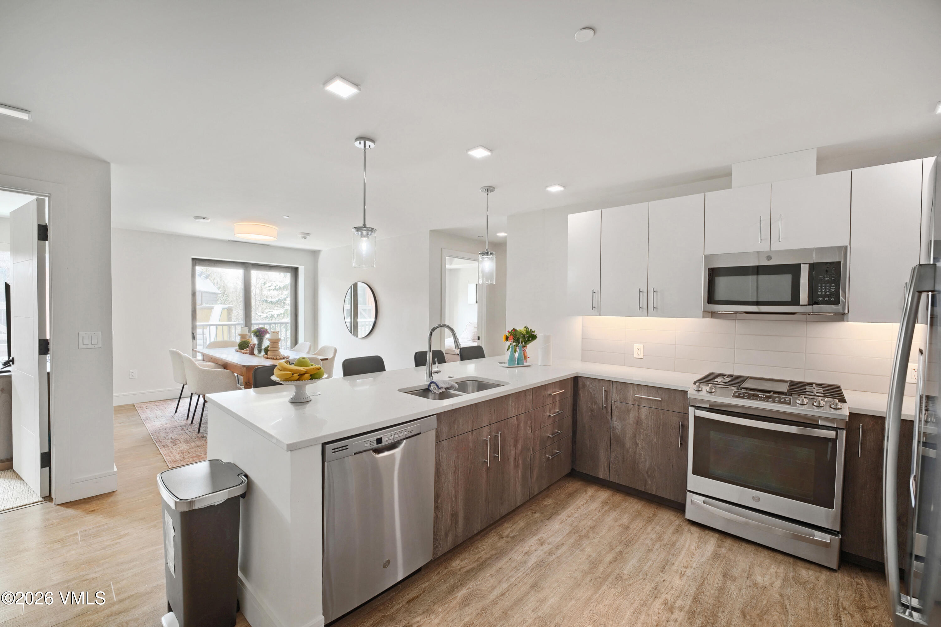 430 South Frontage Road East, Unit RUE Vail, CO 81657 - Photo 7 of 24 a kitchen with a sink stove and cabinets