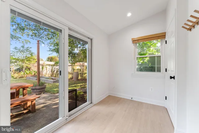 a view of a hallway with washer and dryer