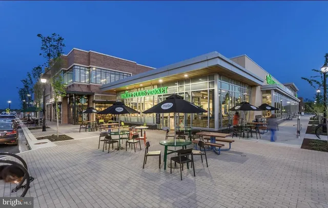 a view of outdoor space with lots of swings and slides