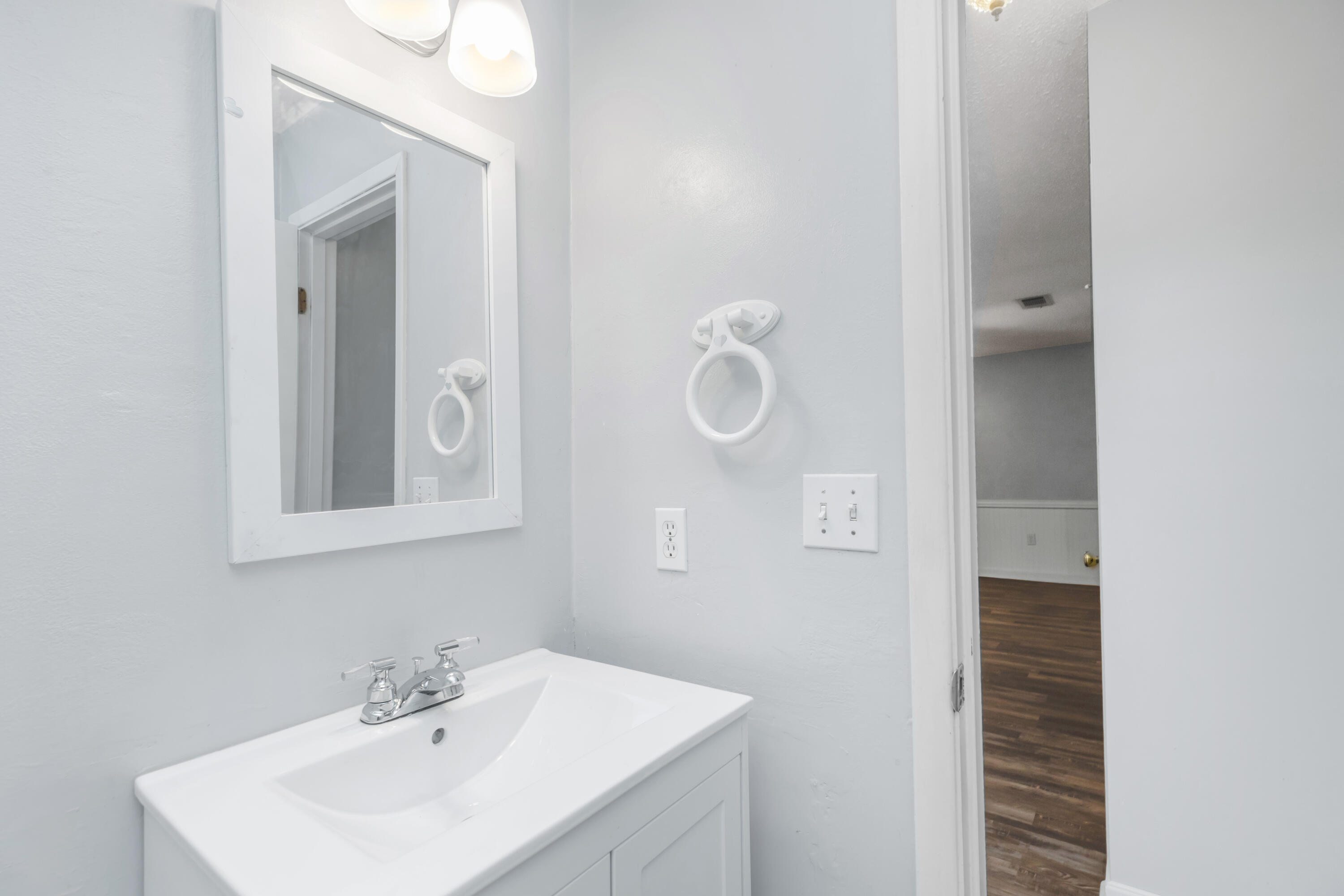 5825 Old Bethel Road Crestview, FL 32536 - Photo 22 of 44 a bathroom with a sink a mirror and shower