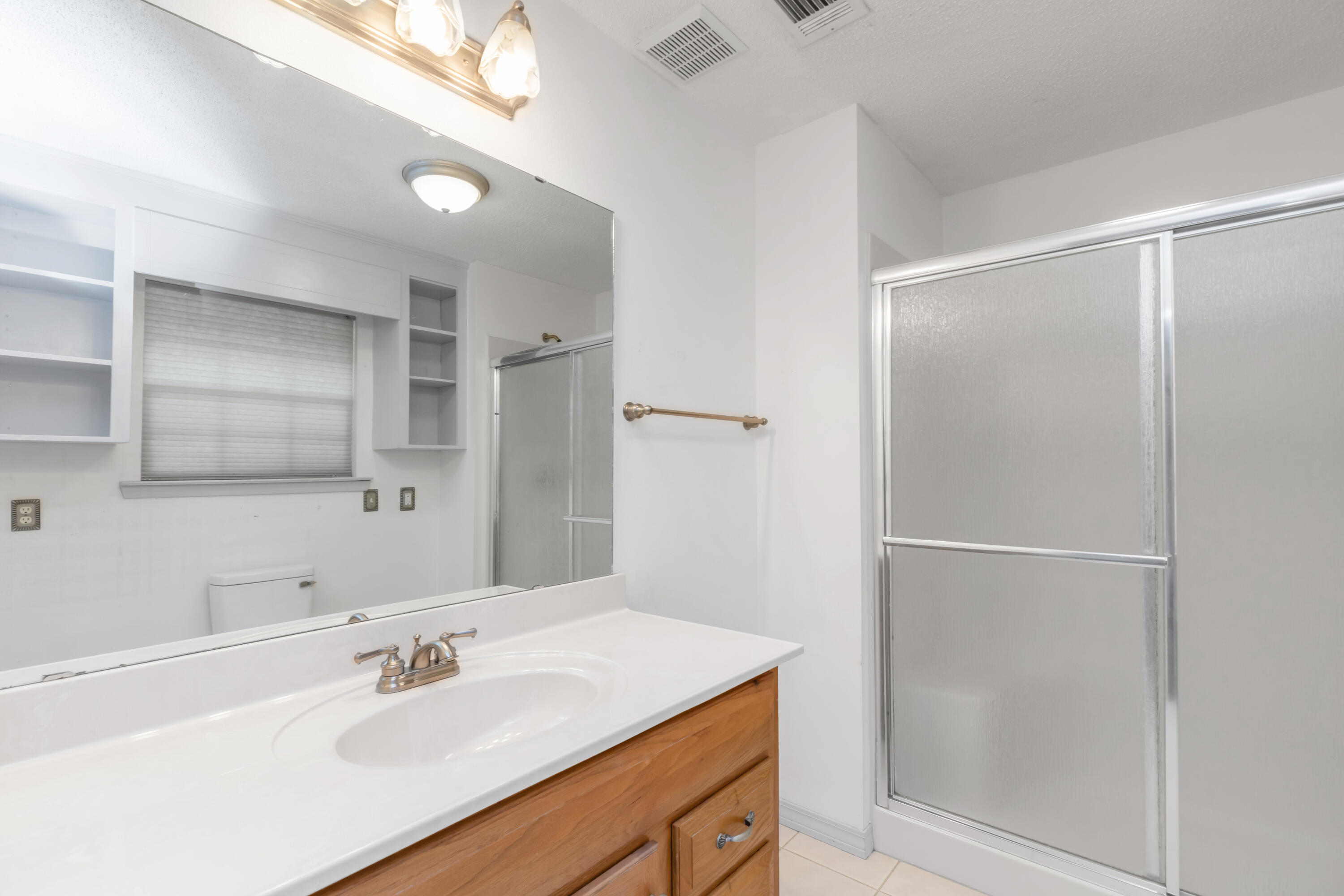5825 Old Bethel Road Crestview, FL 32536 - Photo 26 of 44 a bathroom with a sink and a mirror