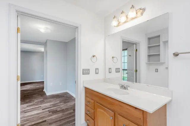 a bathroom with a sink double vanity and a mirror