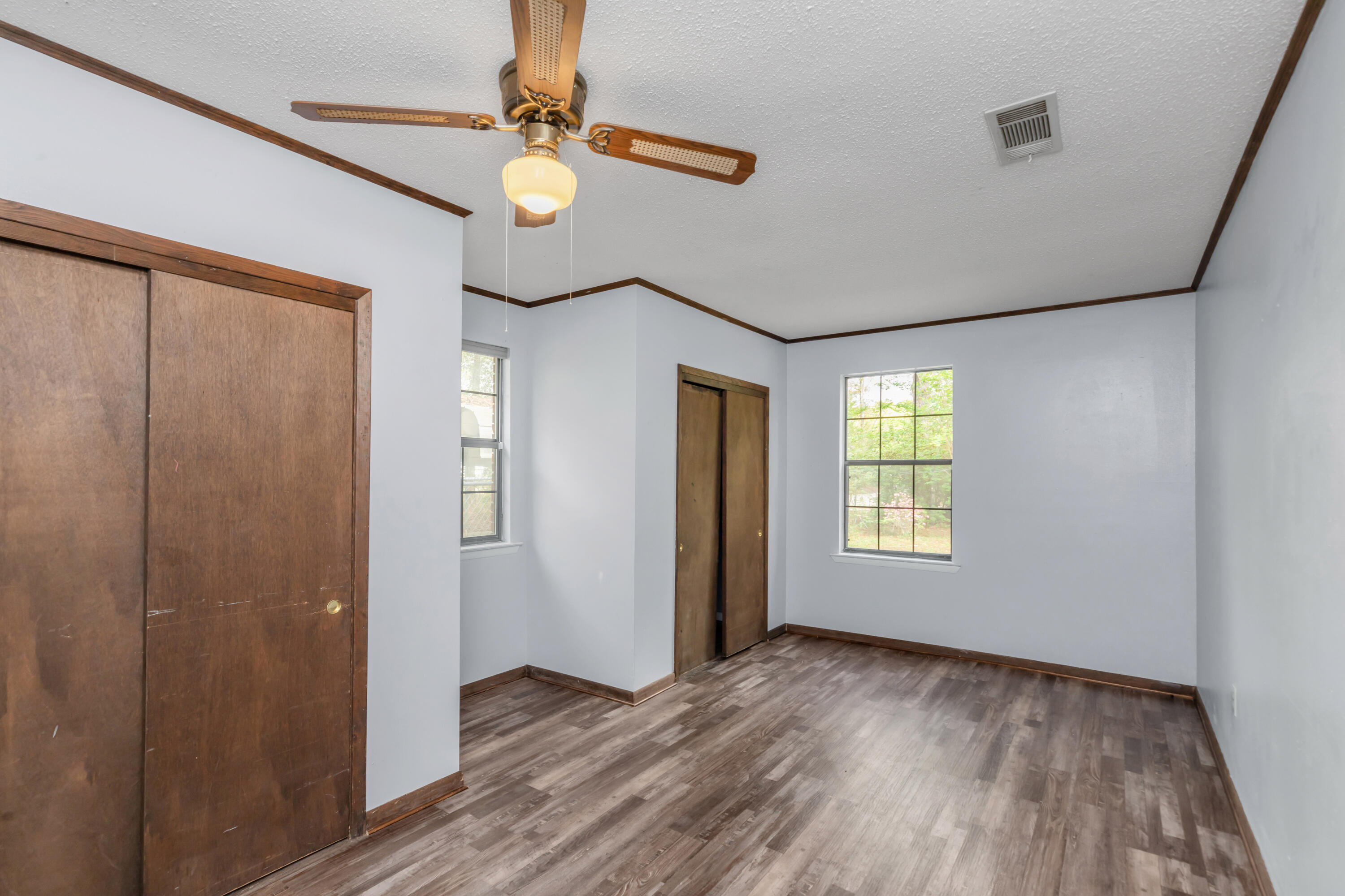5825 Old Bethel Road Crestview, FL 32536 - Photo 30 of 44 a view of an empty room with wooden floor and a window