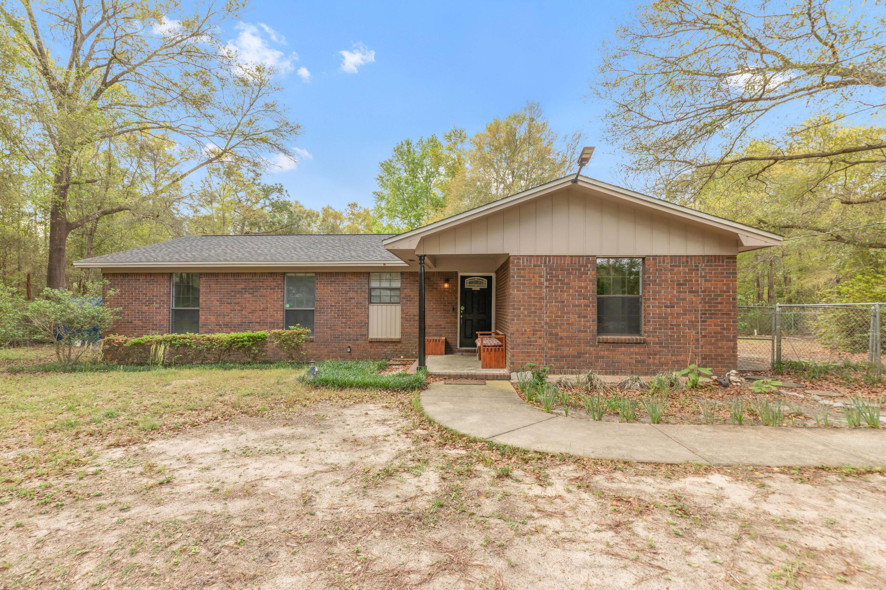 5825 Old Bethel Road Crestview, FL 32536 - Photo 32 of 44 a view of a house with a yard
