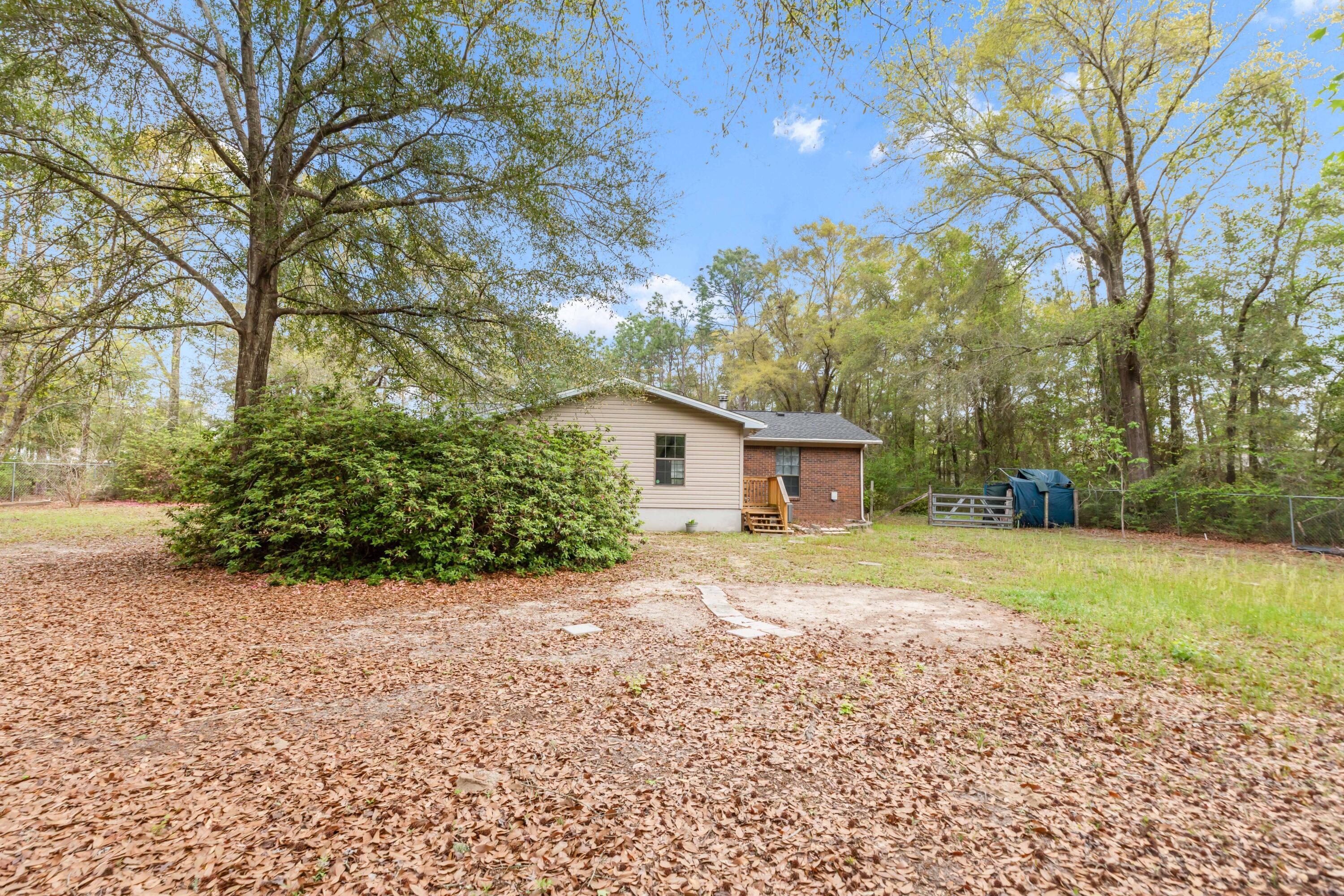 5825 Old Bethel Road Crestview, FL 32536 - Photo 34 of 44 a house with trees in the background