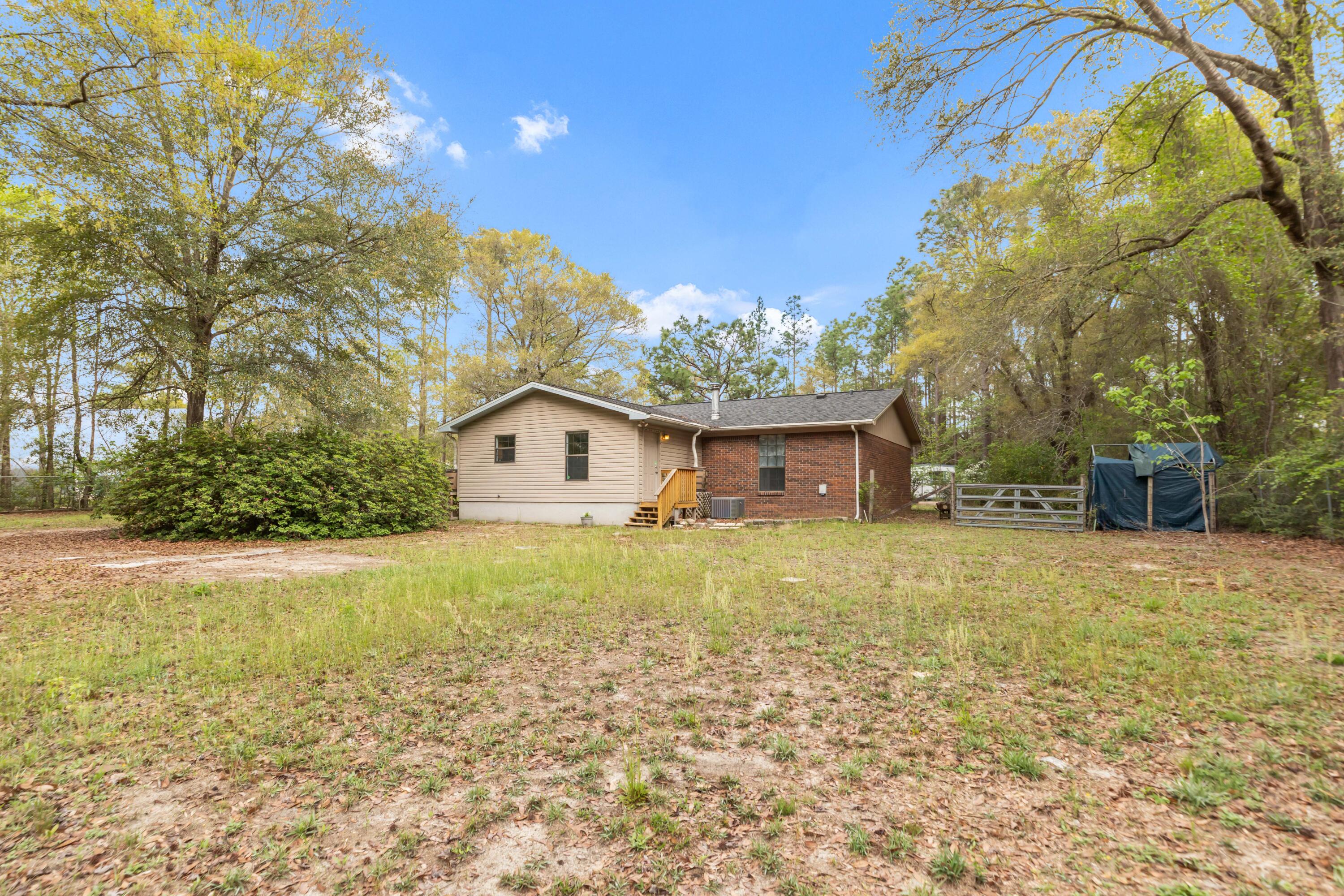 5825 Old Bethel Road Crestview, FL 32536 - Photo 35 of 44 a view of a house with a yard