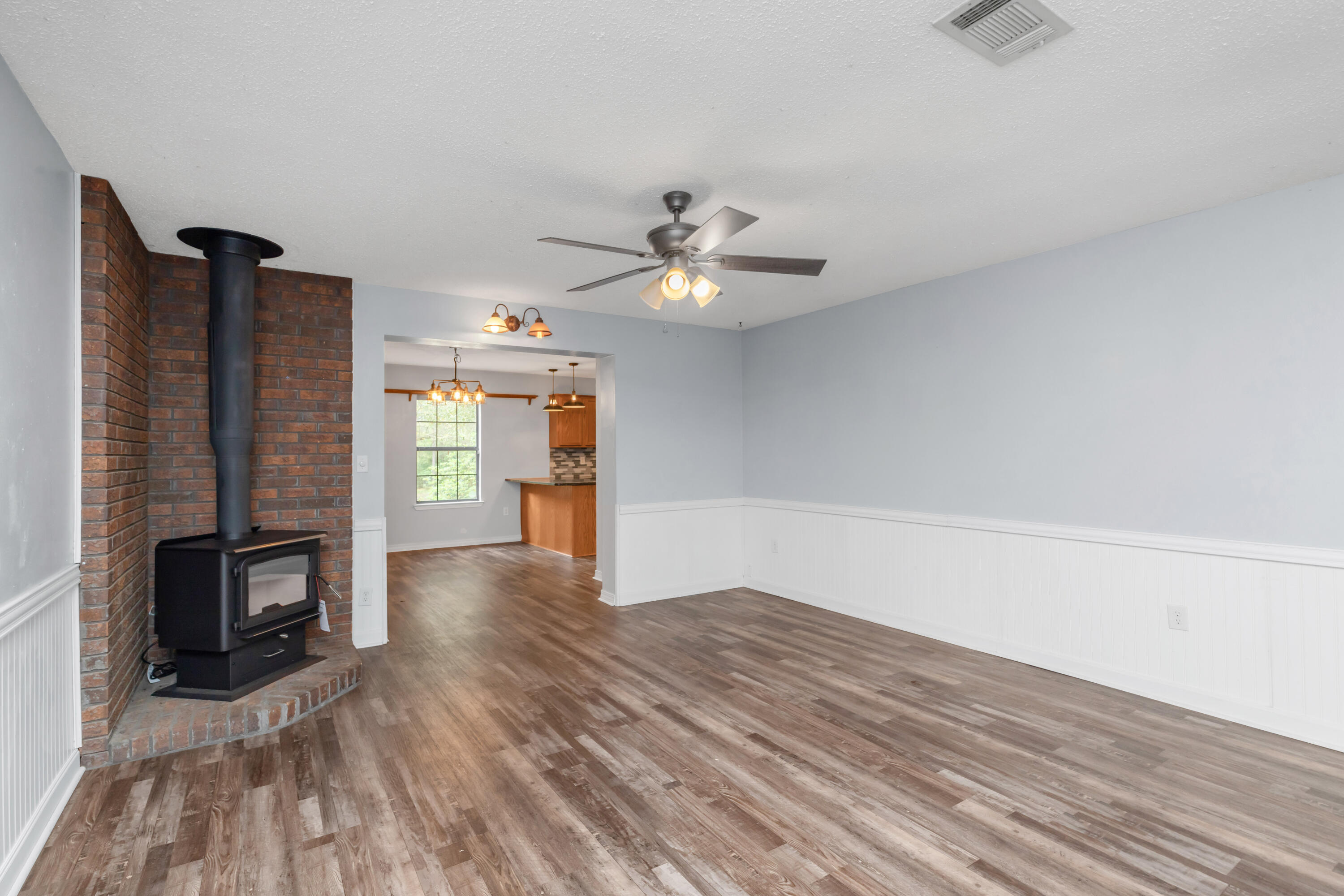 5825 Old Bethel Road Crestview, FL 32536 - Photo 4 of 44 wooden floor in an empty room with a window