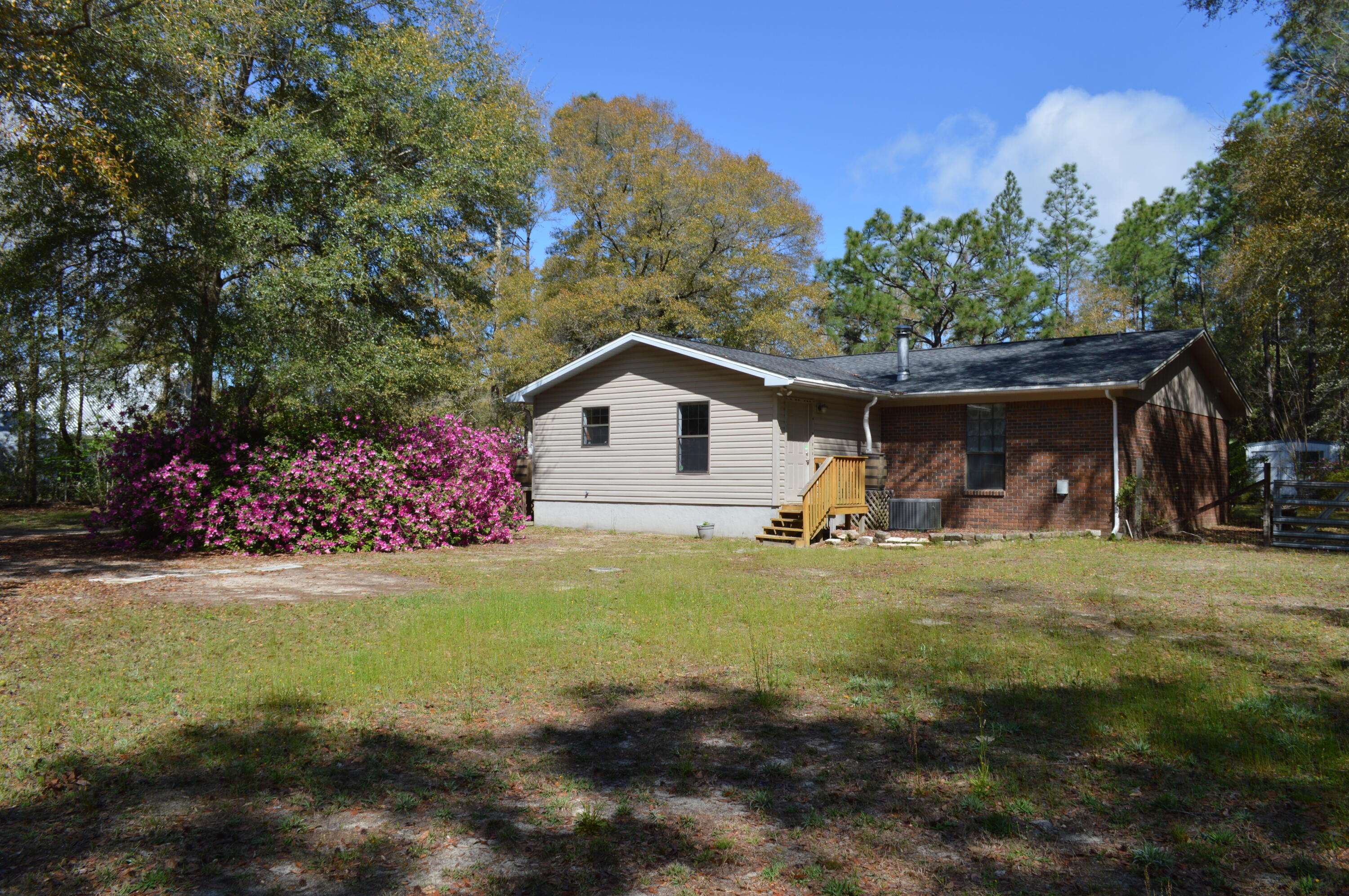 5825 Old Bethel Road Crestview, FL 32536 - Photo 43 of 44 a view of a house with a yard and garage