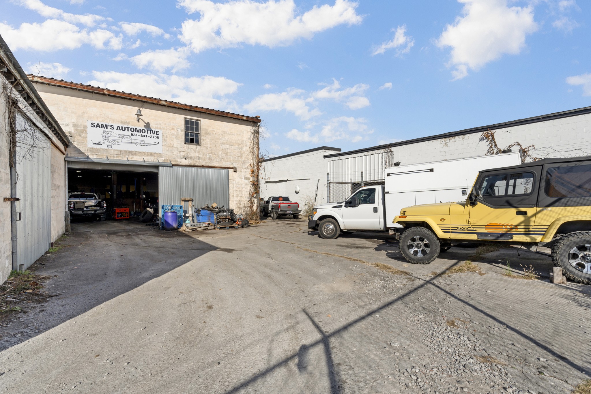 803 McArthur Street Manchester, TN 37355 - Photo 19 of 31 a view of parking space with parked cars