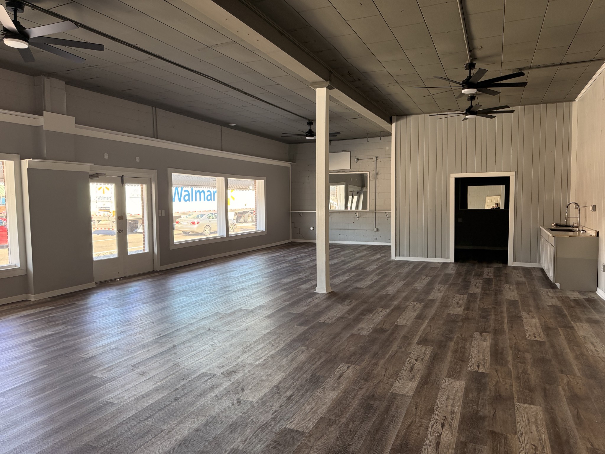 803 McArthur Street Manchester, TN 37355 - Photo 4 of 31 a view of an empty room and window with wooden floor