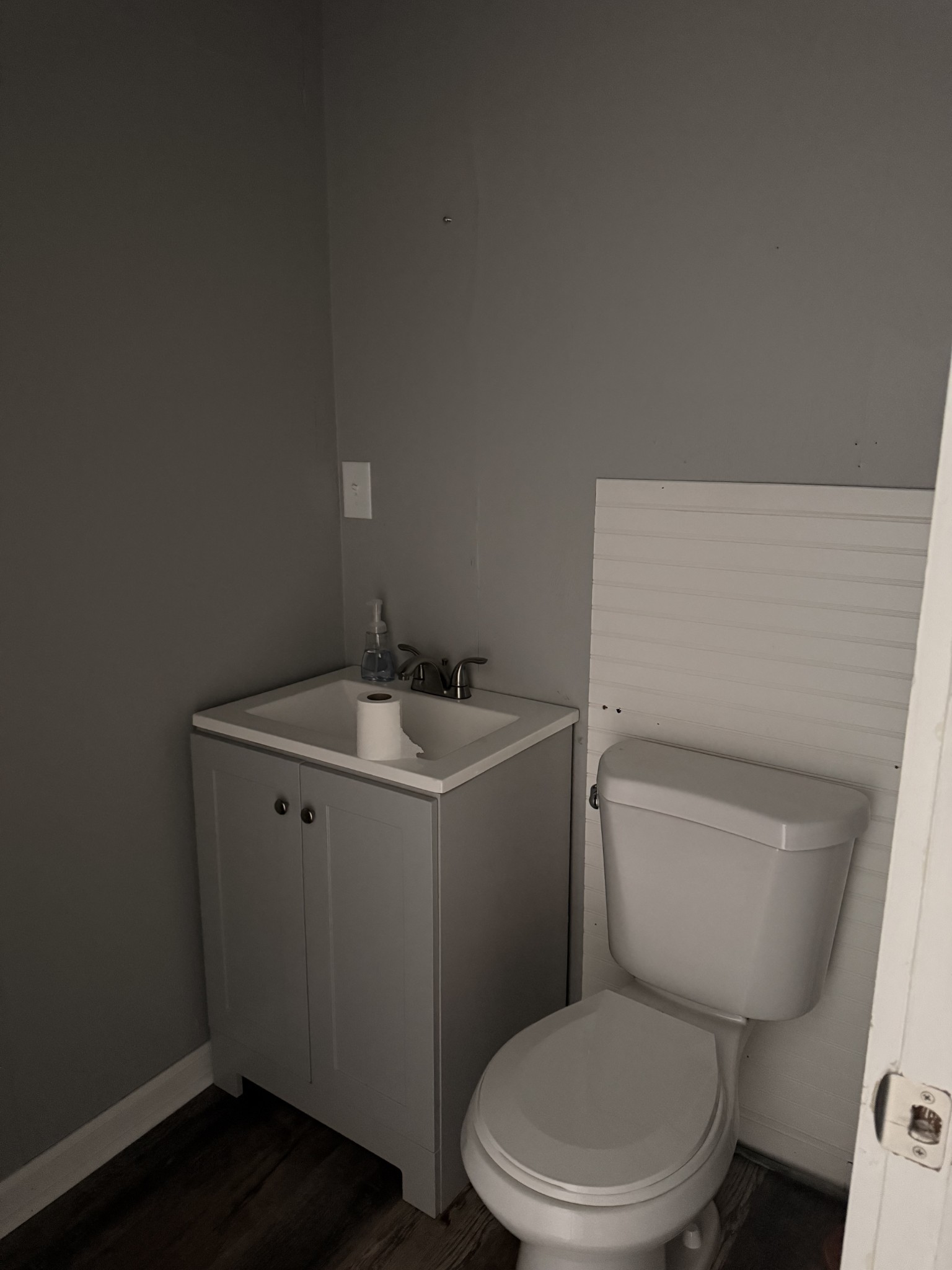 803 McArthur Street Manchester, TN 37355 - Photo 7 of 31 a white toilet sitting next to a bathroom sink