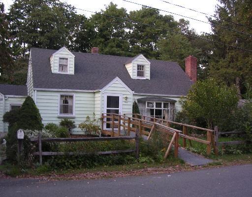 a aerial view of a house with a yard