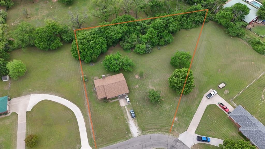 415 Meadowlark Trail Springtown, TX 76082 - Photo 1 of 35 an aerial view of a house with swimming pool and lake view