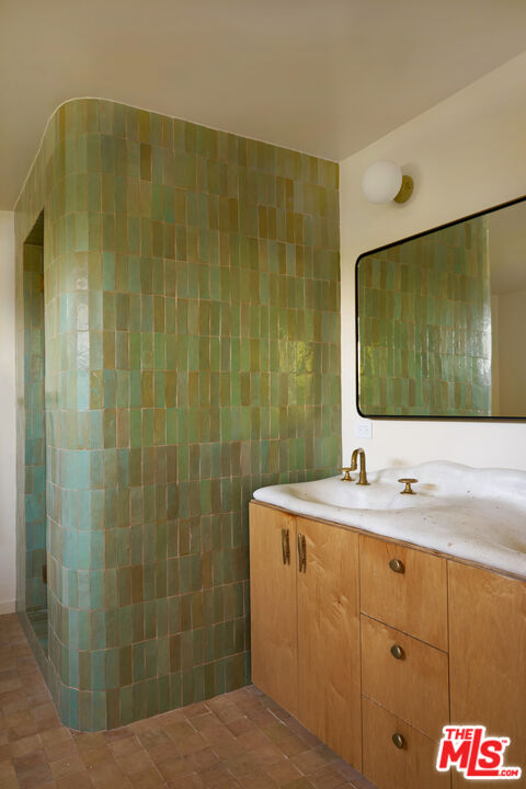 29500 Heathercliff Road, Unit 288 Malibu, CA 90265 - Photo 11 of 26 a bathroom with a sink and a mirror
