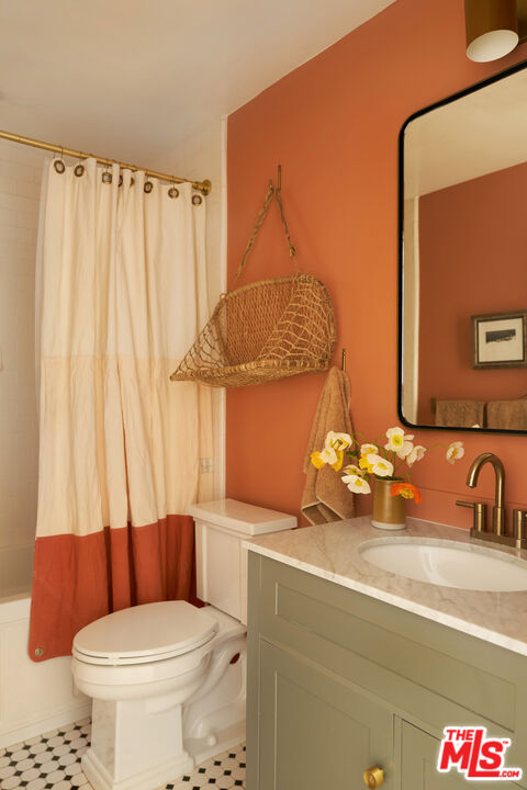 29500 Heathercliff Road, Unit 288 Malibu, CA 90265 - Photo 15 of 26 a bathroom with a sink a toilet and shower curtain