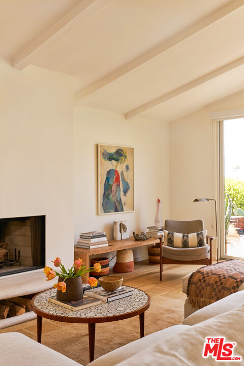 29500 Heathercliff Road, Unit 288 Malibu, CA 90265 - Photo 22 of 26 a living room with furniture and a flat screen tv