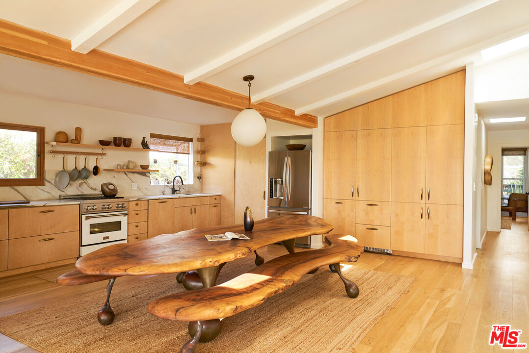 29500 Heathercliff Road, Unit 288 Malibu, CA 90265 - Photo 6 of 26 a room with wooden floor and furniture