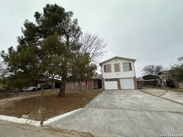 114 Danielle Drive Del Rio, TX 78840 - Photo 2 of 7 a white house that has a tree in front of it