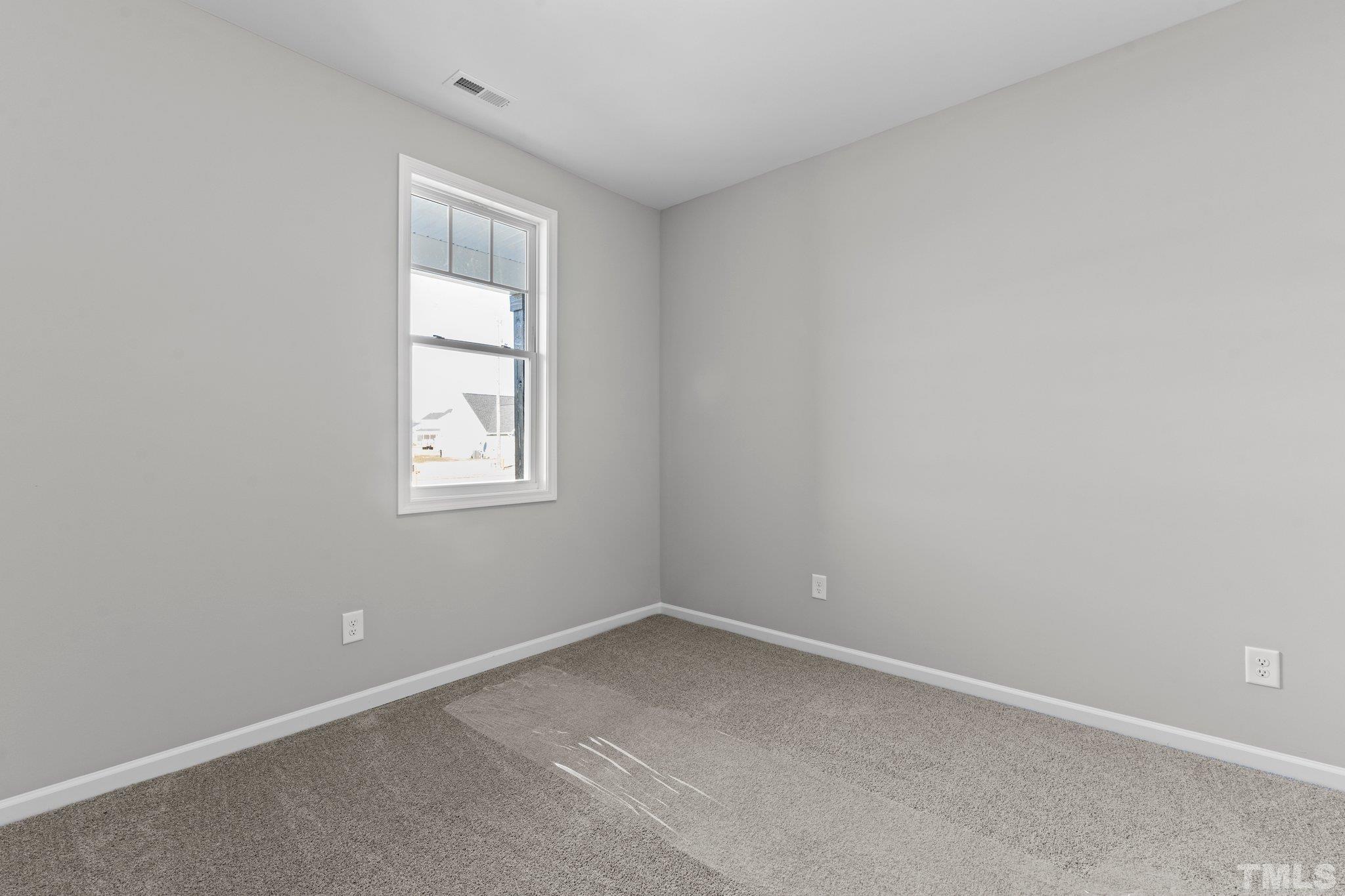 9695 Chapman Road Bailey, NC 27807 - Photo 11 of 26 an empty room with a window