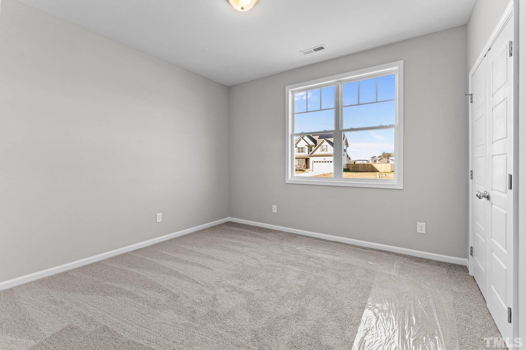 9695 Chapman Road Bailey, NC 27807 - Photo 13 of 26 a view of an empty room with a window