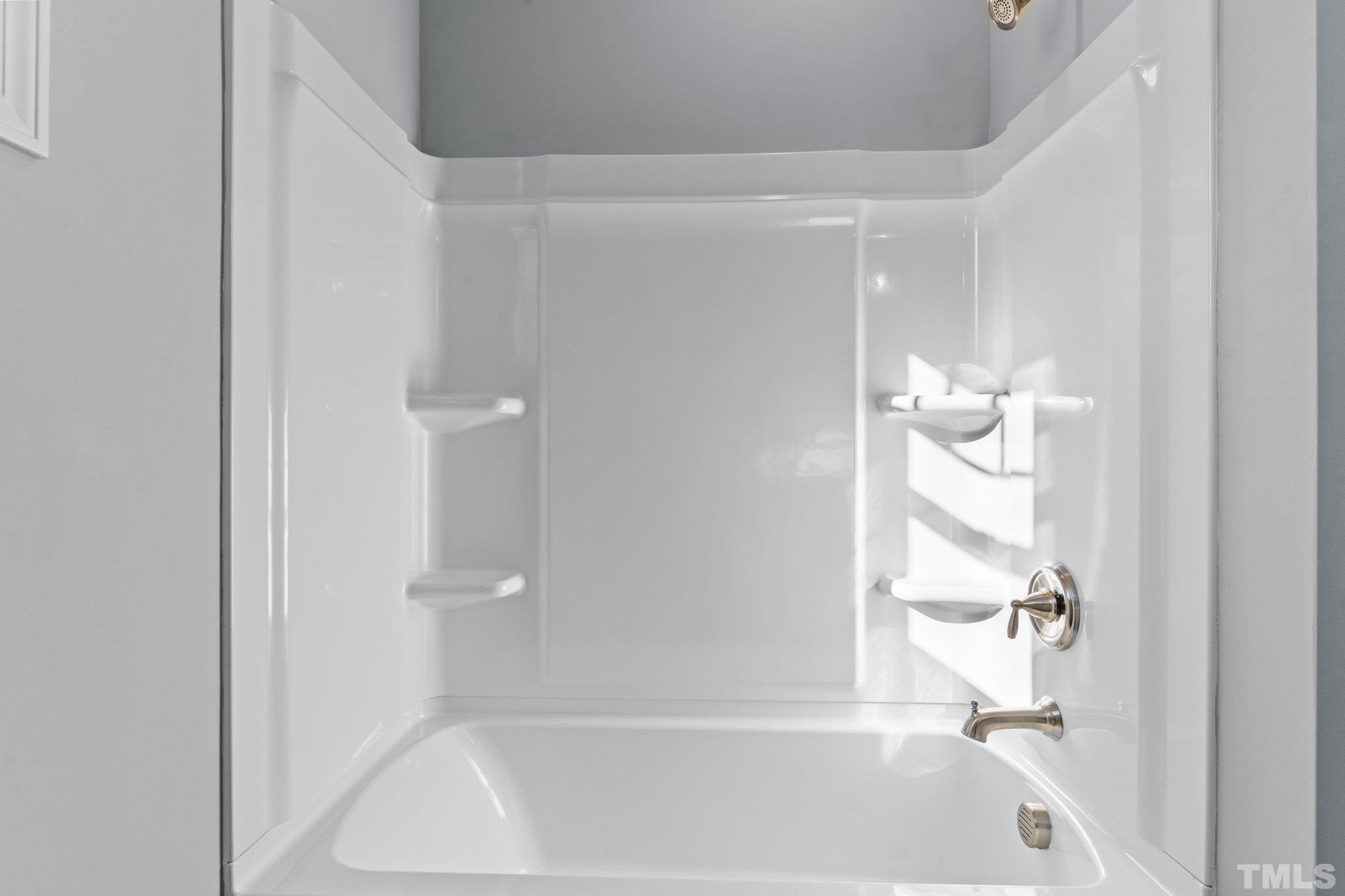 9695 Chapman Road Bailey, NC 27807 - Photo 14 of 26 a bathroom with a bathtub