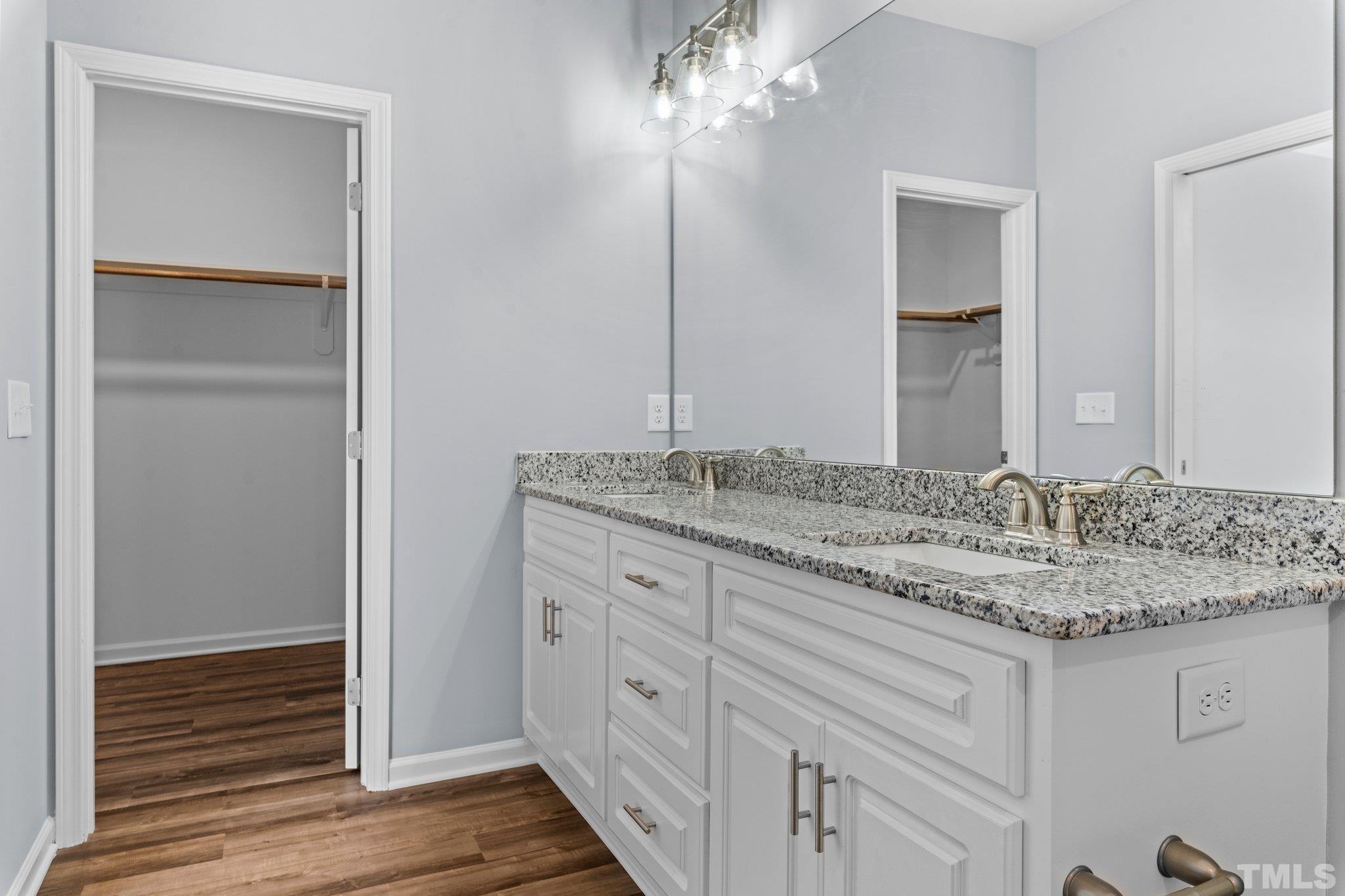 9695 Chapman Road Bailey, NC 27807 - Photo 18 of 26 a bathroom with a granite countertop sink and a mirror
