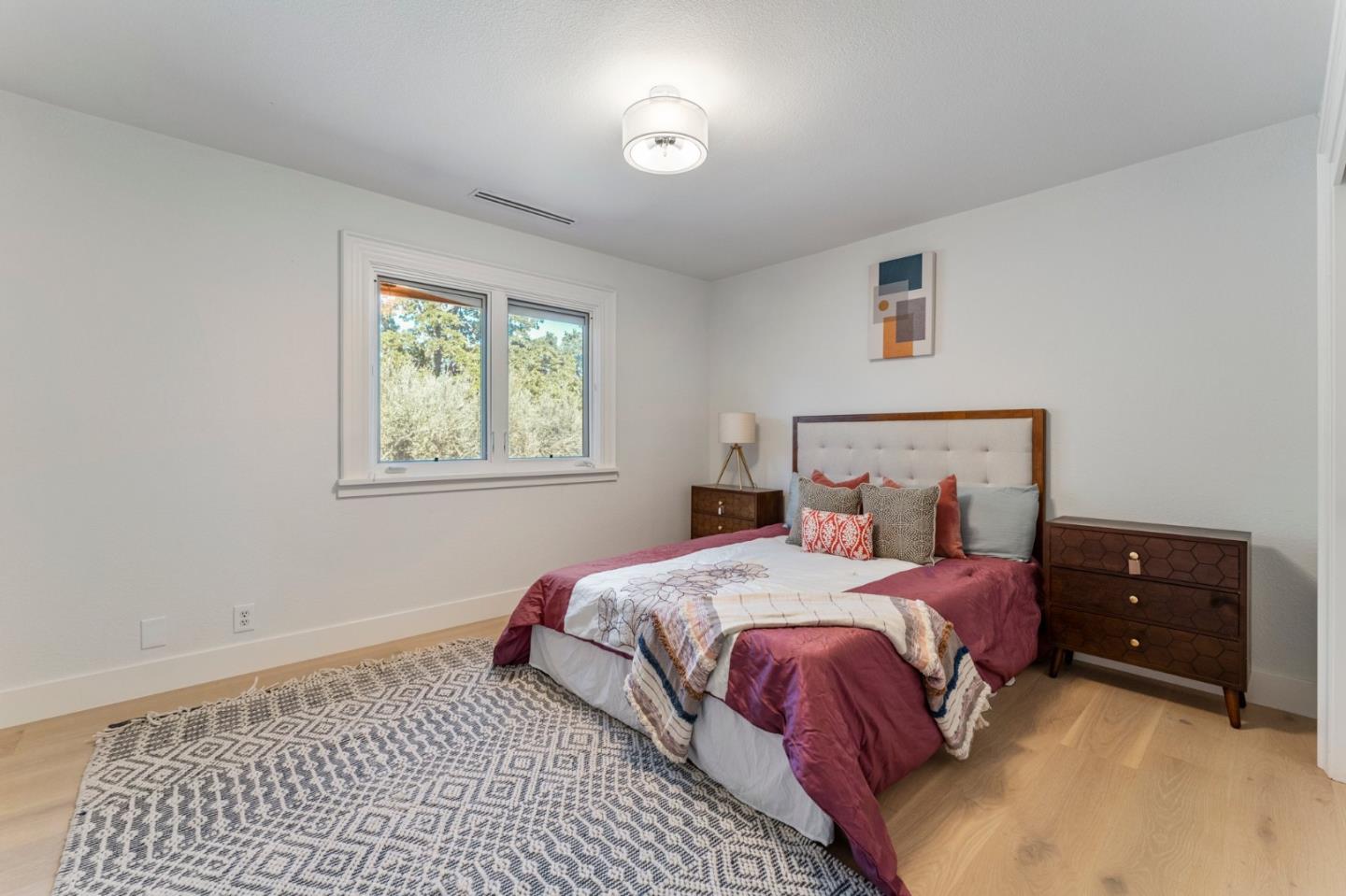 1080 Finley Road Pleasanton, CA 94588 - Photo 47 of 85 a bedroom with a bed and a lamp
