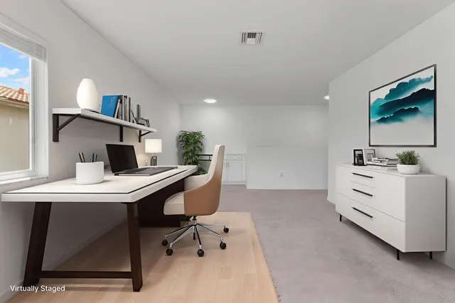 a room with furniture and a flat screen tv