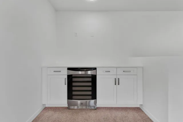 an empty room with white walls