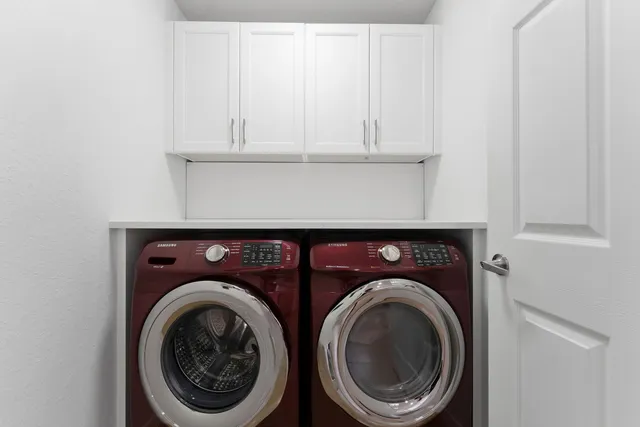 a utility room with dryer and washer