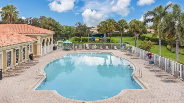 a view of a swimming pool with a patio