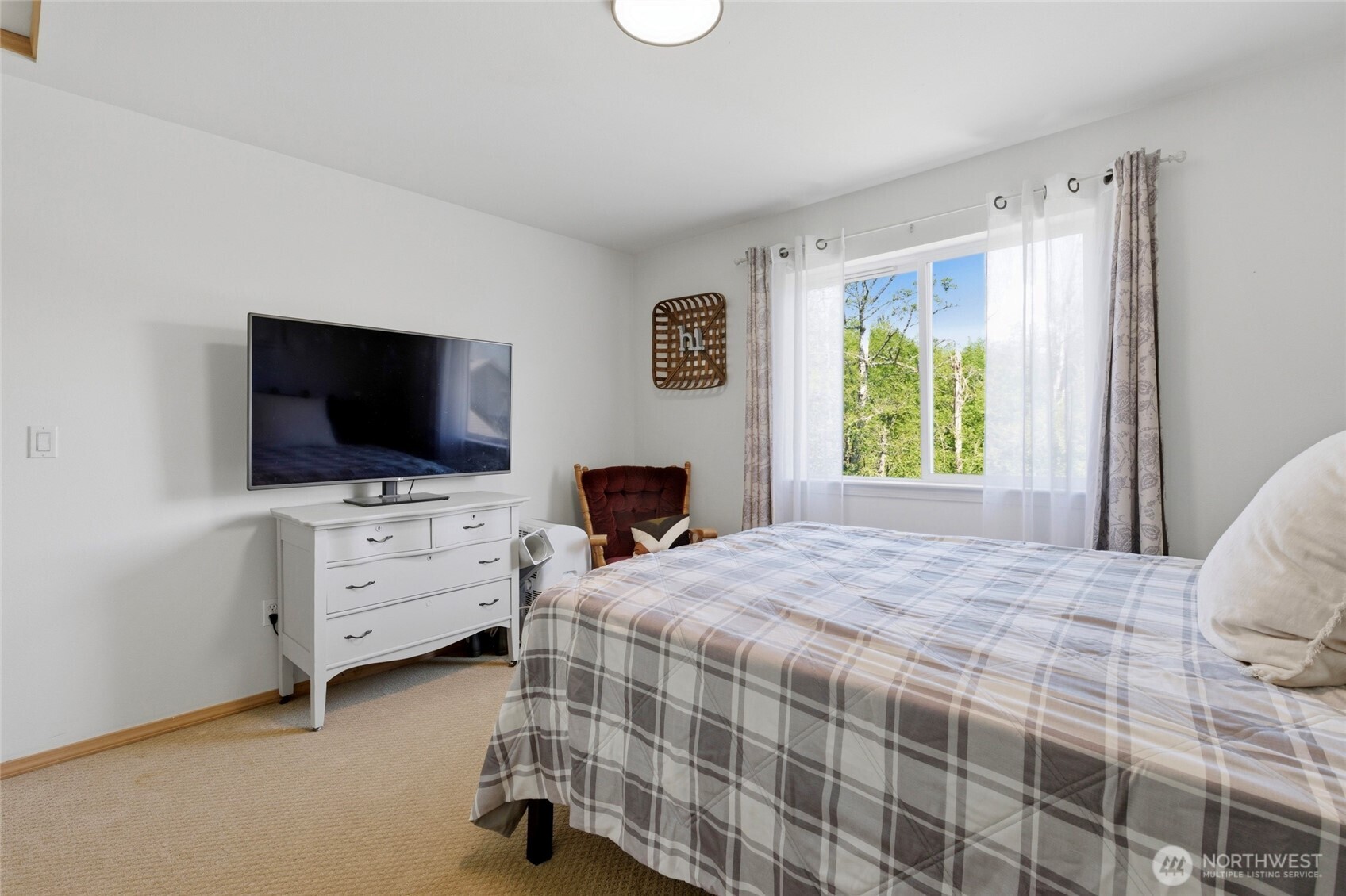 14005 Cedar Court Sultan, WA 98294 - Photo 23 of 38 a bedroom with a bed and flat screen tv