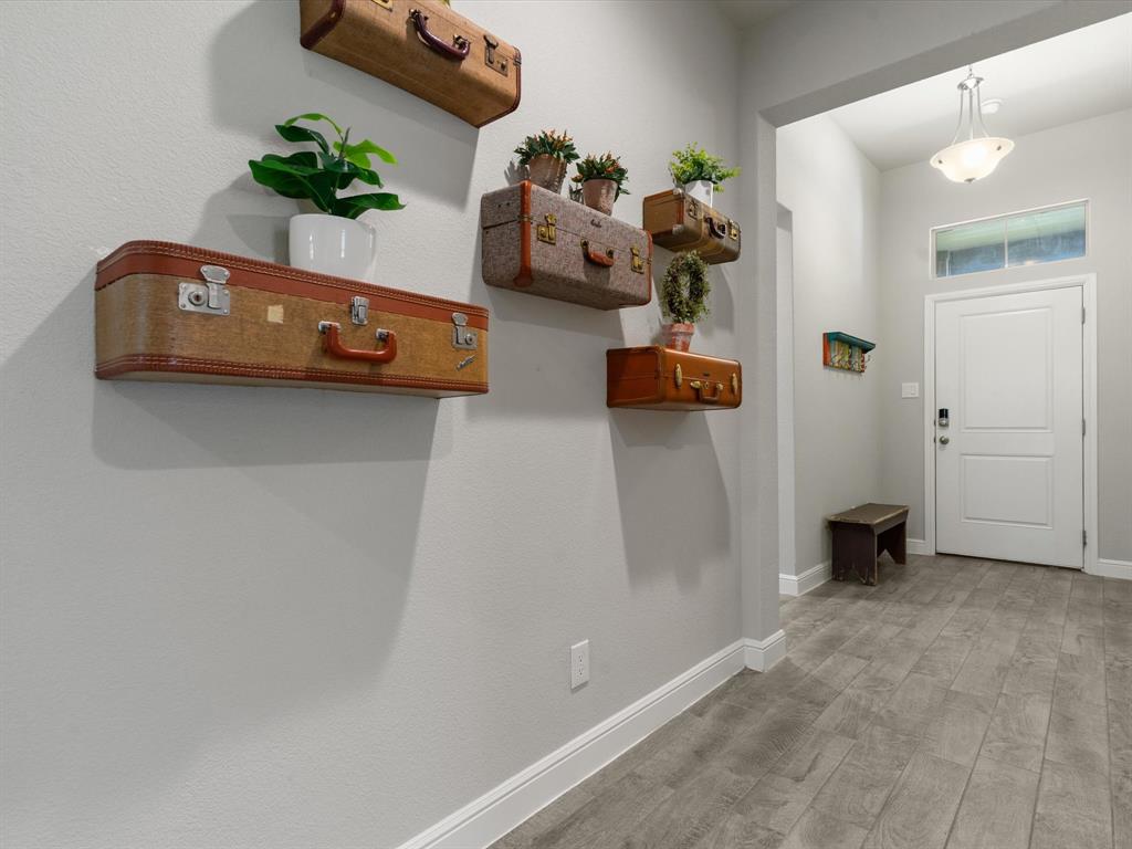 270 Lunayena Road Rhome, TX 76078 - Photo 5 of 37 A welcoming entryway creates a warm first impression, offering a functional transition into the home's open living spaces with easy access to the main gathering areas.