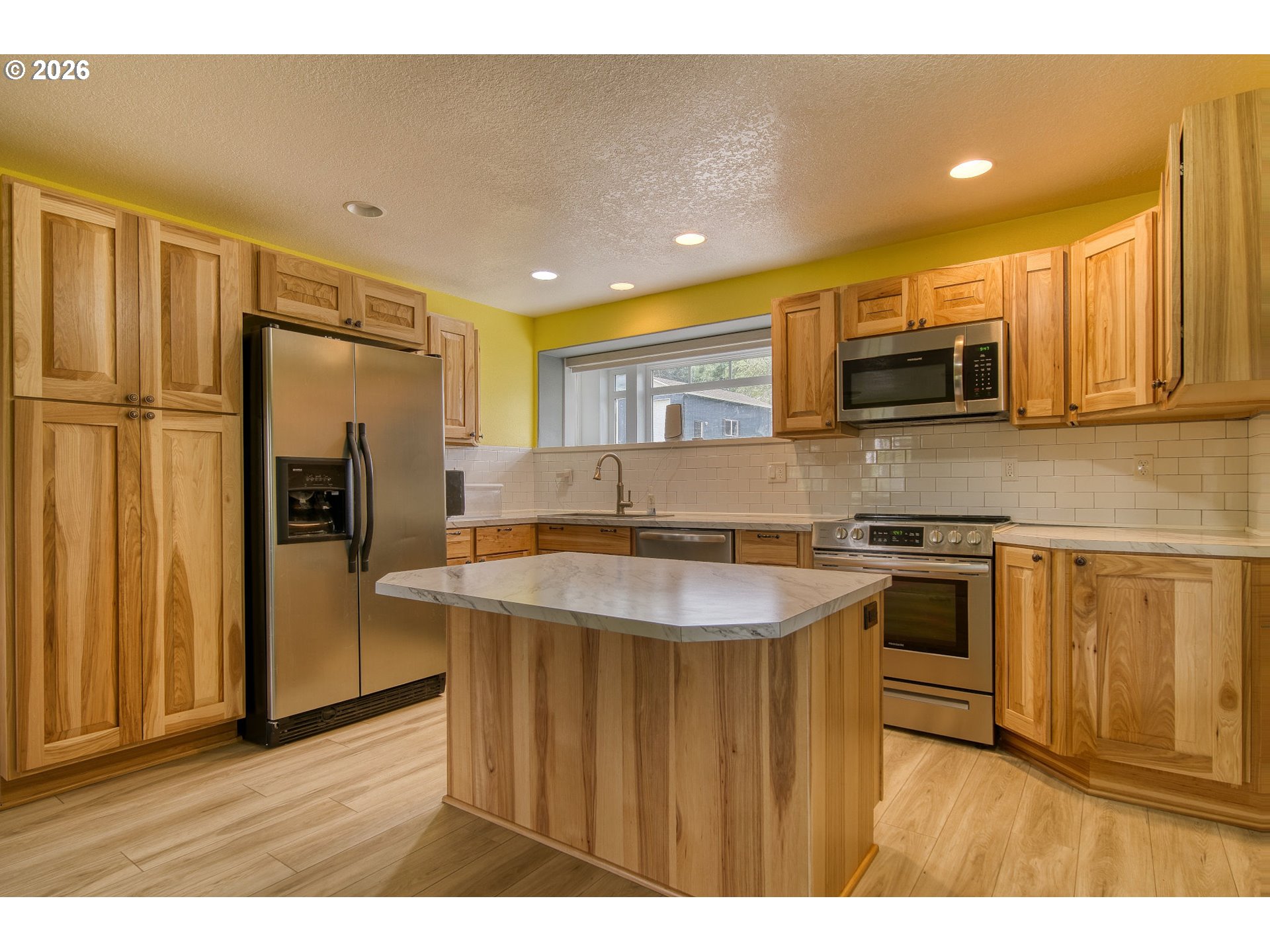 35432 Spence Street St. Helens, OR 97051 - Photo 26 of 48 a kitchen with stainless steel appliances granite countertop a stove a sink and a refrigerator