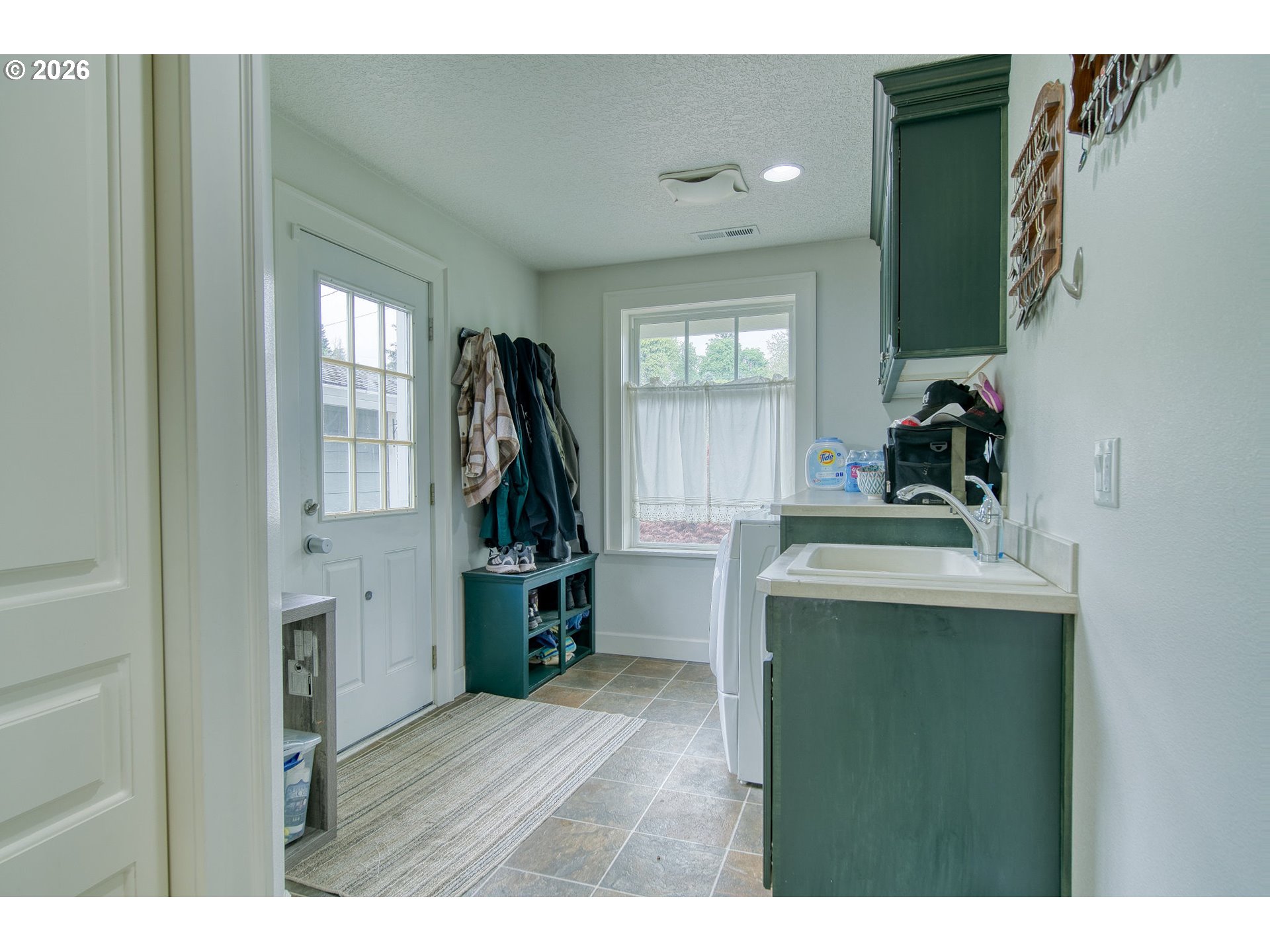 35432 Spence Street St. Helens, OR 97051 - Photo 32 of 48 a view of a kitchen with a sink and a window